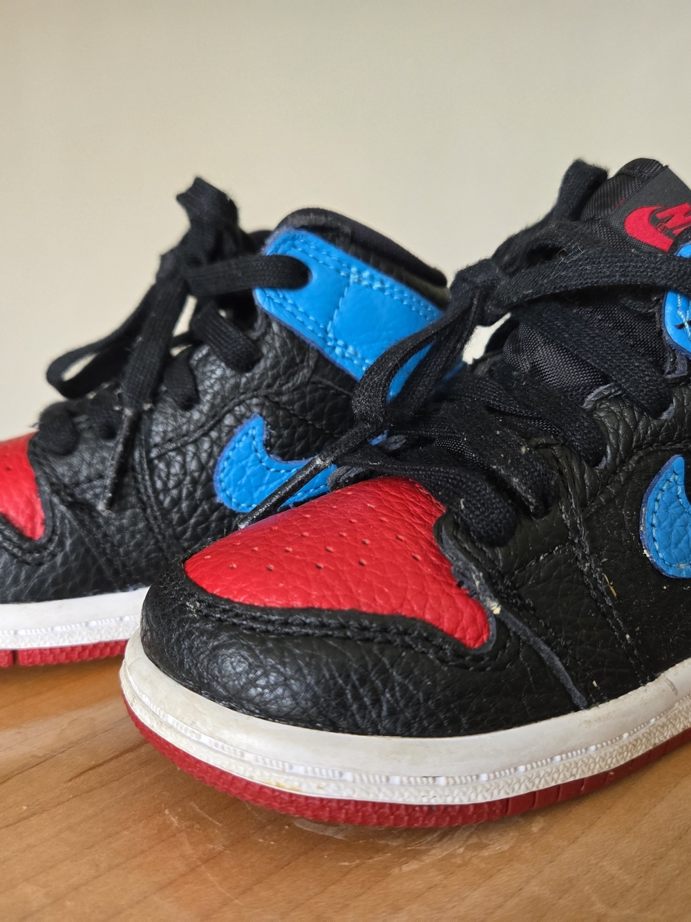 Nike Kids Air Jordan Black Sneakers with Red Toe and Blue Swoosh